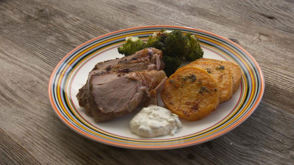 Easter Leg of Lamb on a wooden table