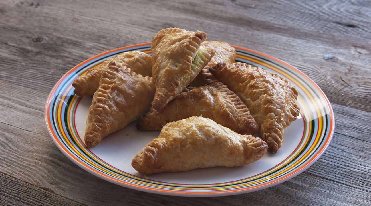 Lamb Pastry Triangles with Feta on a plate