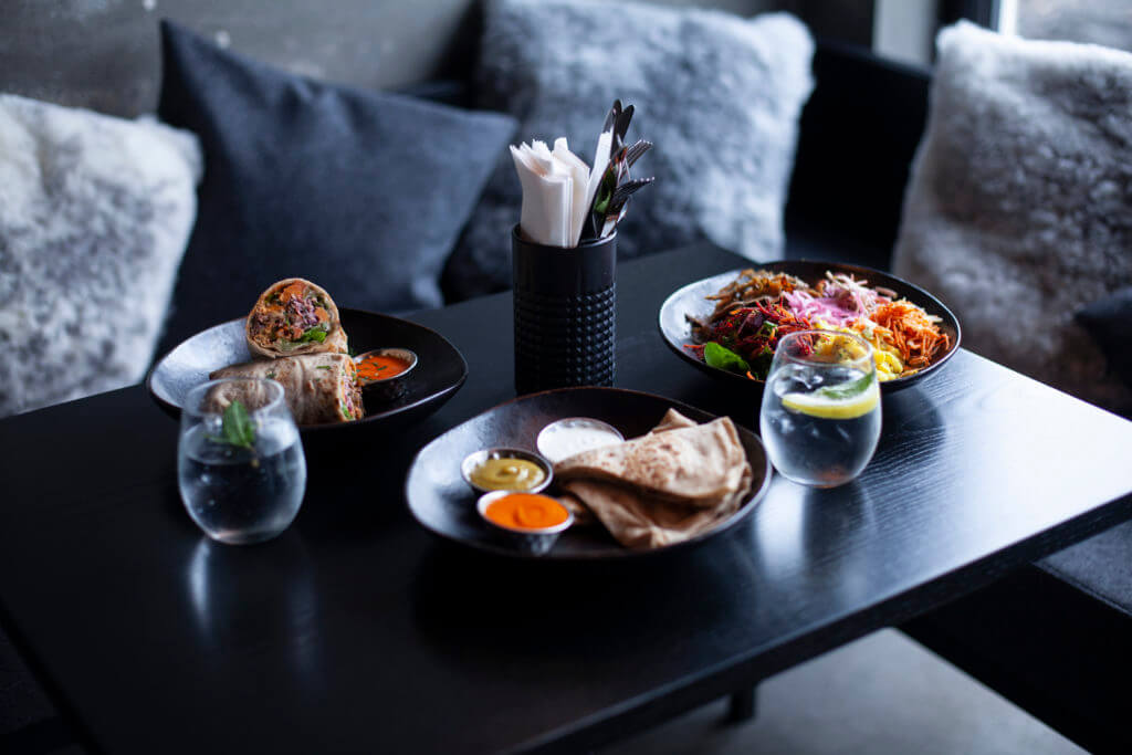 table served with lamb dishes and drinks